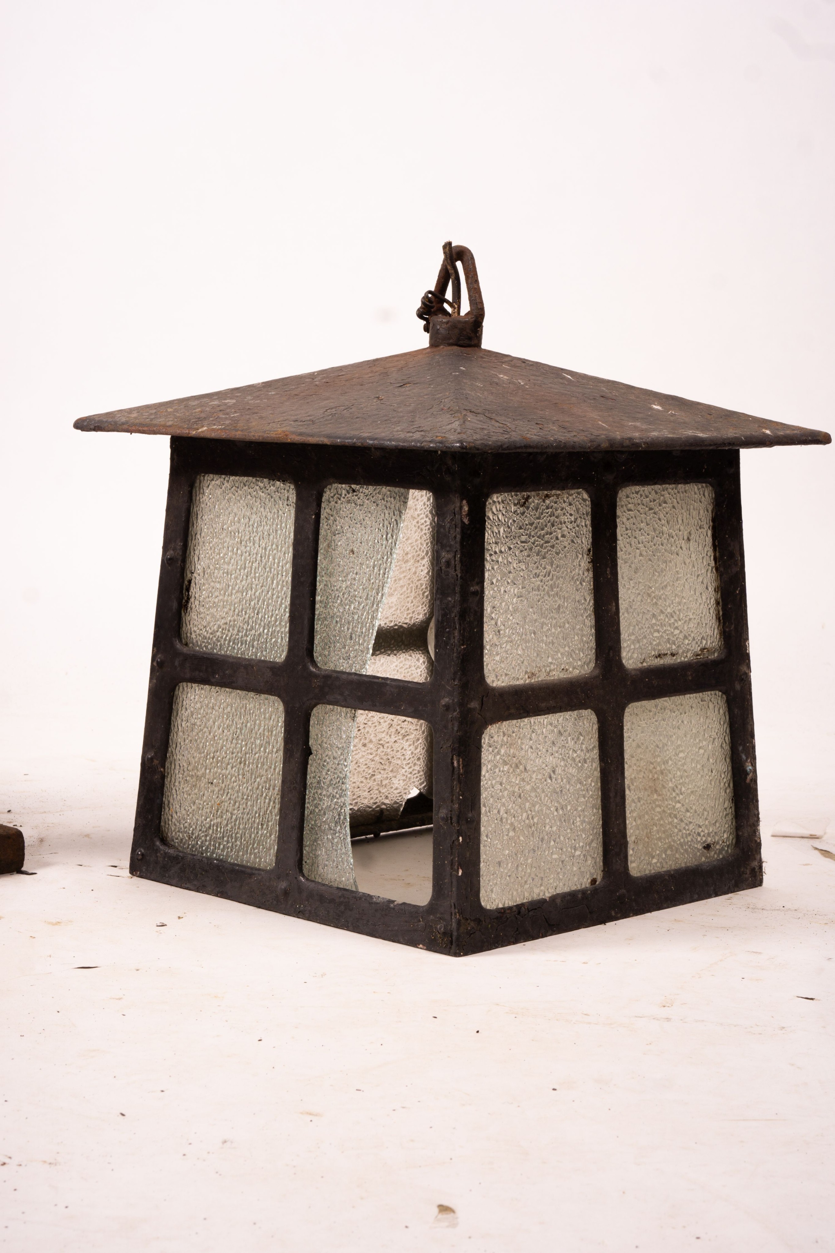 A Victorian style lantern on cast iron base, height 143cm together with a pair of lanterns and a pair of fire dogs